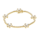 YELLOW GOLD BAGUETTES AND DIAMOND FLOWER TENNIS BRACELET