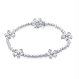 YELLOW GOLD BAGUETTES AND DIAMOND FLOWER TENNIS BRACELET